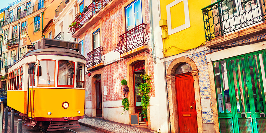 Yellow,Vintage,Tram,On,The,Street,In,Lisbon,,Portugal.,Famous