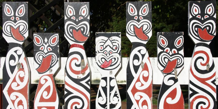 Maori tribal art on wooden fence