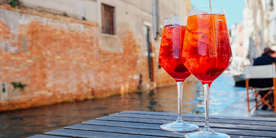 Two,Glasses,Of,Spritz,Veneziano,Cocktail,Served,Near,The,Venetian